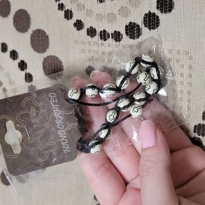 Ivory Adjustable Bead Bracelet with Black Crosses